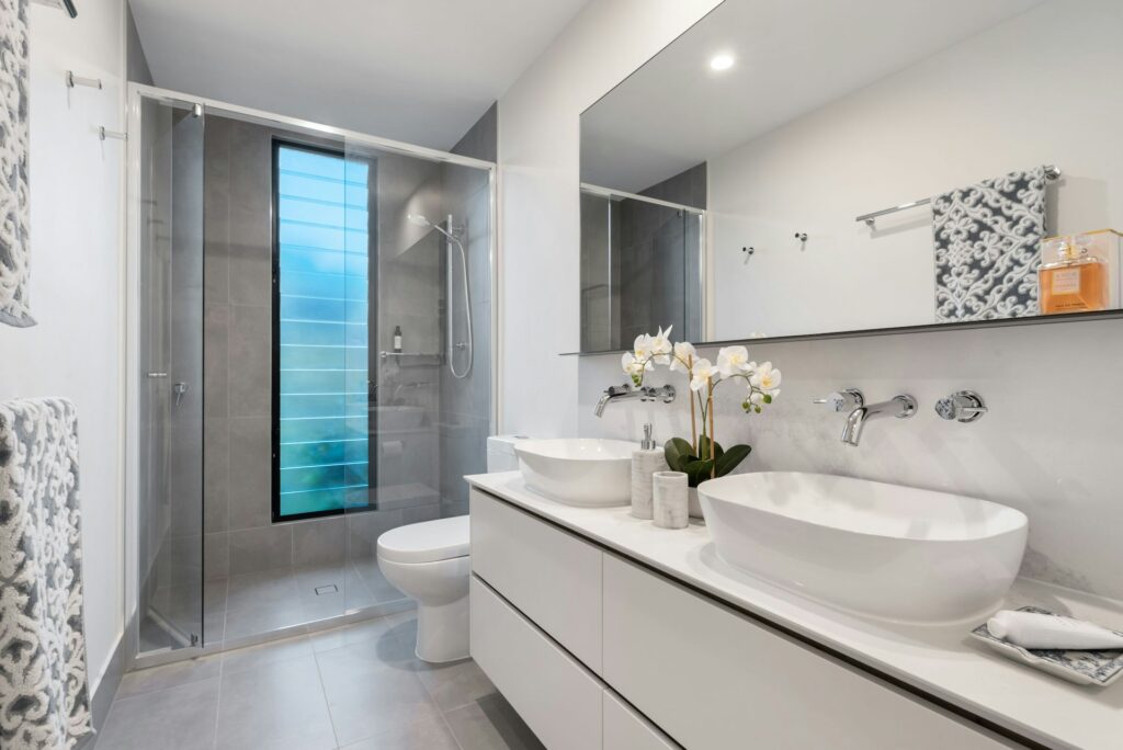 Bathroom storage solutions small Australian homes — shower niche and over-toilet shelving 2026