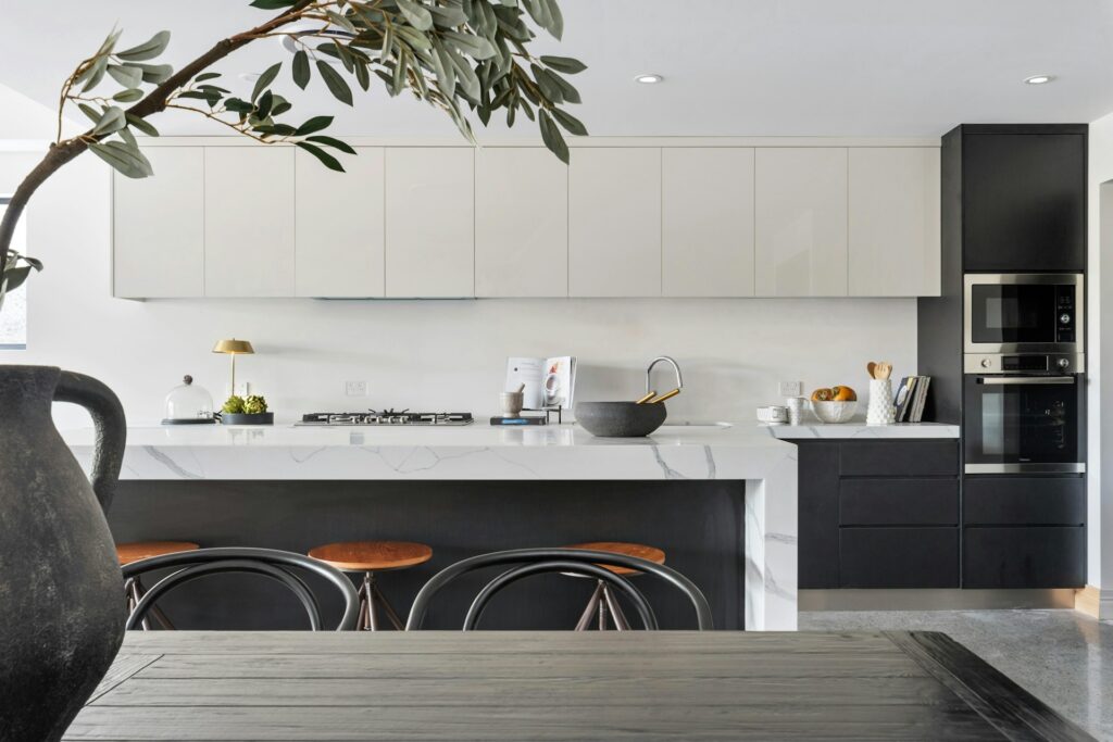 Vertical storage solutions small Australian homes — floating shelves and pegboard kitchen 2026
